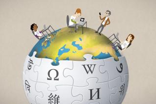 Une sphère mélangeant la terre et le logo Wikipedia, surmontée de personnages en train de travailler